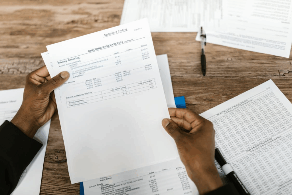 a person holding bank statements