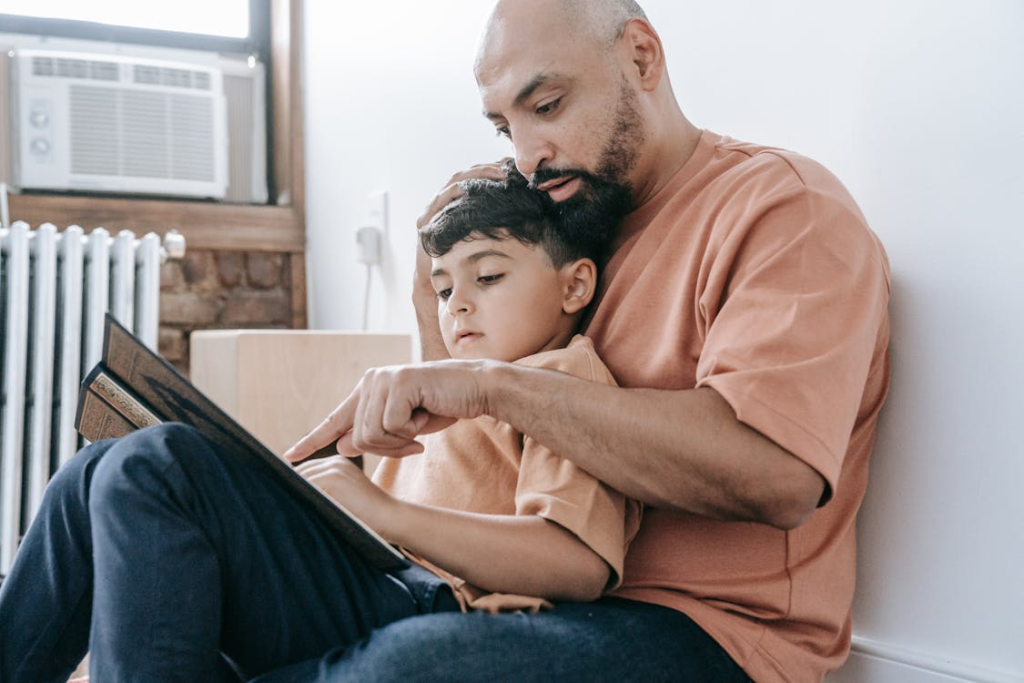 A father and son reading a book