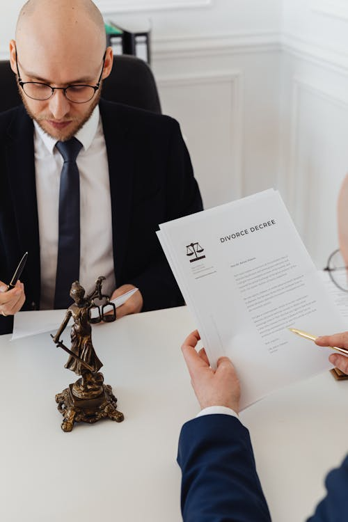 A person reading divorce papers