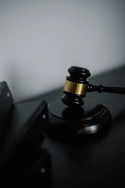 A wooden gavel on a stand symbolizing justice and legal authority