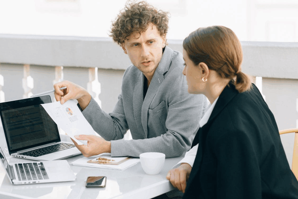 An image of a man showing a paper to a woman