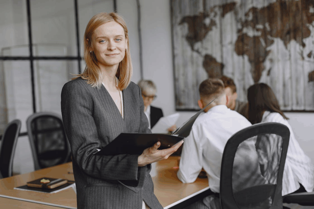 An image of a woman holding a file