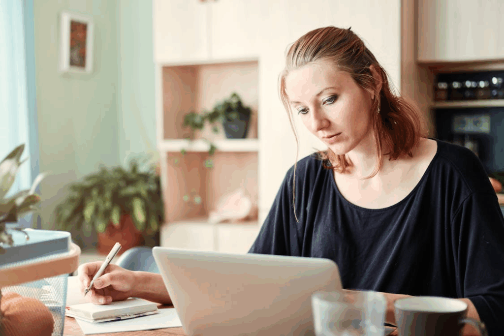 An image of a woman using a laptop