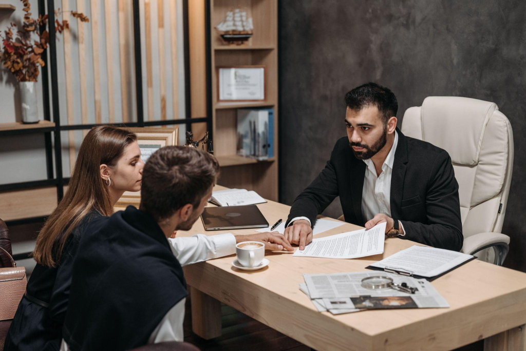 a couple going over their marriage contract with a lawyer