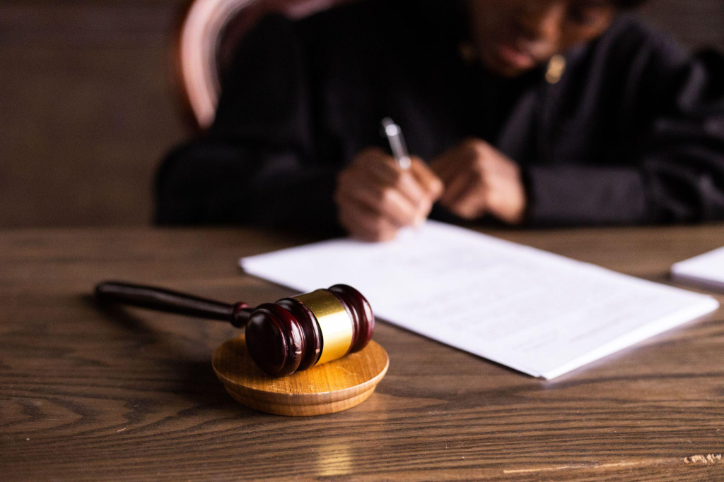 a judge signing a document