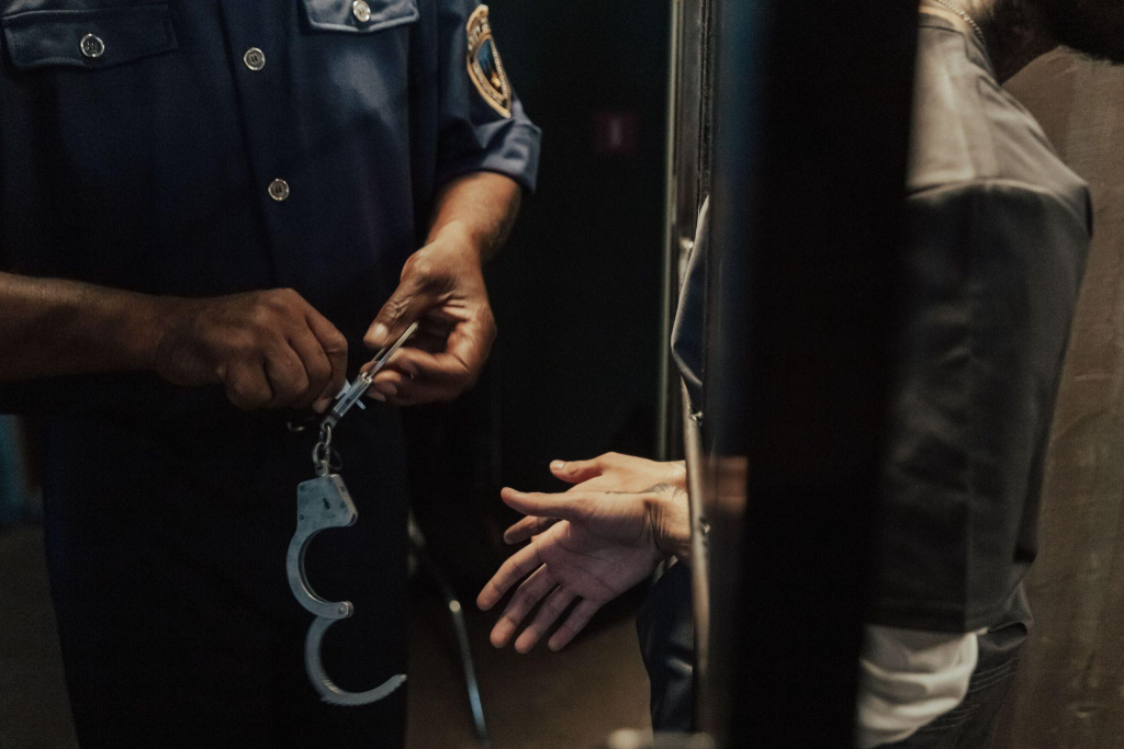 a person under arrest for violating bail conditions