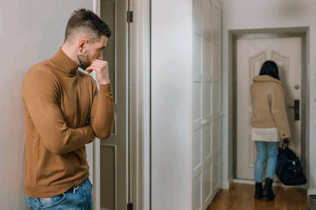 man watching his partner leave the apartment after a high-conflict separation in Mississauga