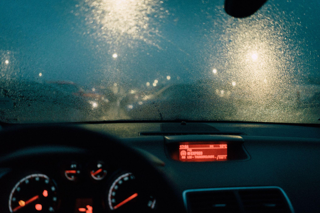 view of a windshield blurred by rainfall
